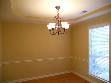 Formal dining room with laminate flooring and upda