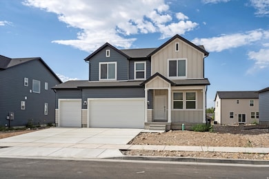 View of front of home with board and batten siding, concrete driveway, roof with shingles, and a garage