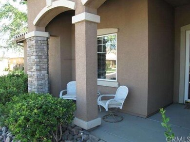 Relax on the lovely front porch, under graceful do