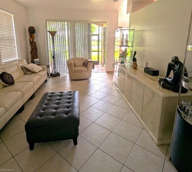 Living area with light tile patterned flooring