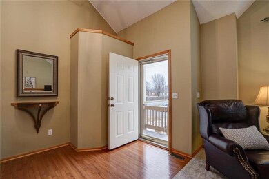 Entry w inviting storm door, vaulted ceiling and h