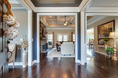 At the entrance, you are greeted by warm finished wood floors.