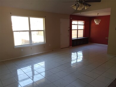 FAMILY ROOM WITH CATHEDRAL CEILING AND EXTENSIVE CERAMIC TILE - OPEN CONCEPT.