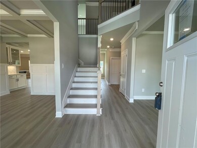 Staircase featuring ornamental molding, hardwood /