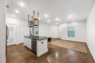 Kitchen featuring dark countertops, dishwasher, f