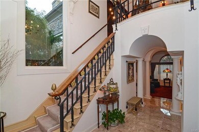 2 story foyer, marble tile floors, custom made iro
