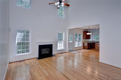 Hardwood floored living room featuring a fireplace
