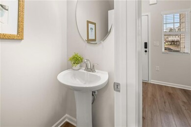 Bathroom with wood finished floors and baseboards