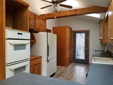 Large Kitchen with brand new flooring! Glass door 
