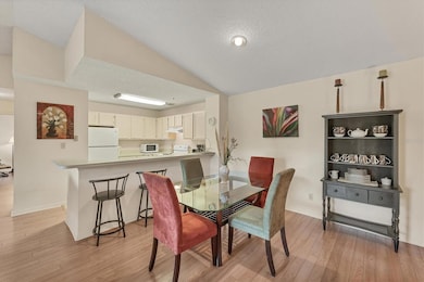 Spacious dining area with a full size open kitchen.