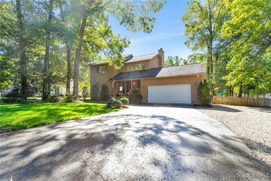View of front of property with a front yard and a