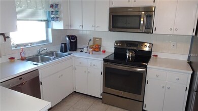 Plenty of counter tops, tile floors and back-splas