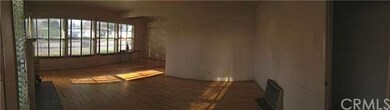 Panoramic view of living room from front door.