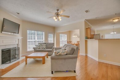 Great Room with fireplace-door to patio & pass  through to Kitchen and separate formal Dining room.