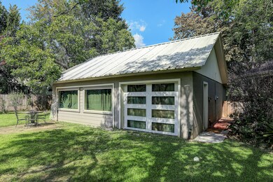 The garage has been converted to a studio/workshop with central AC and a half bath