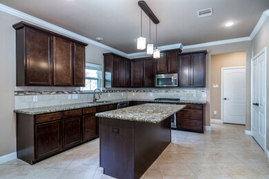 Large Cabinets, island Kitchen with Built In Stainless Appliances