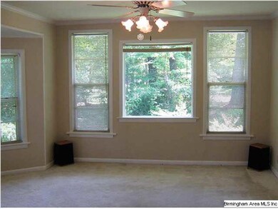 Living room with a wooded view
