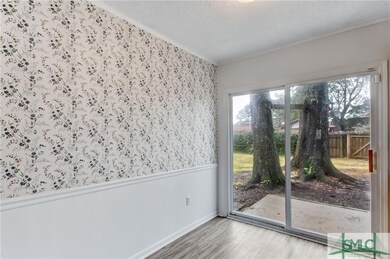 DINING AREA OPEN TO KITCHEN AND LEADS TO BACK PATI