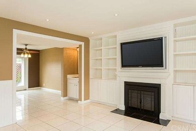 Gas fireplace with custom shelves, a TV with movin