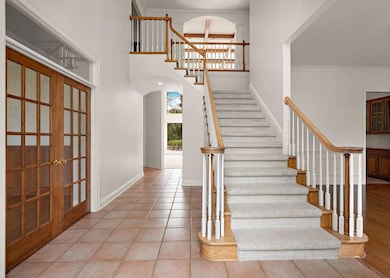 Front entryway with grand staircase.