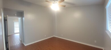Unfurnished room featuring dark wood finished flo