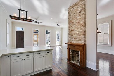 View from the kitchen into the living and dining a