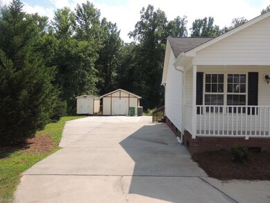 Extra parking and 2 storage sheds!