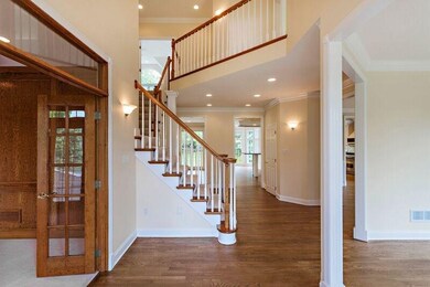 Striking 2-Story foyer with angled catwalk.  The e