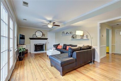 The welcoming family room is enhanced by the firep