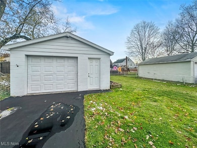 Detached garage featuring driveway