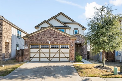 View of front of property featuring an attached g