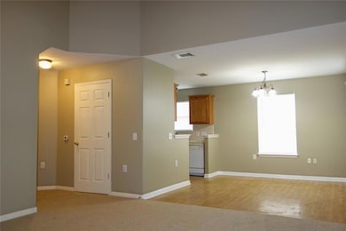 From LIving looking into the Dining, Kitchen and hall going to Master bedroom.