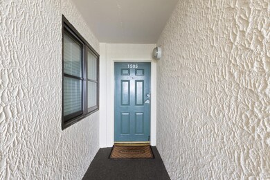 Property entrance with stucco siding