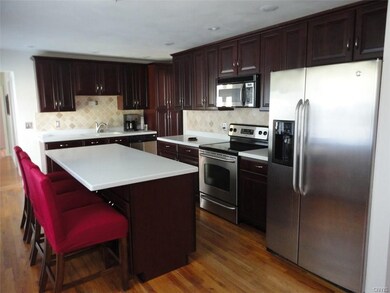 Remodeled kitchen with cherry cabinets and corian 
