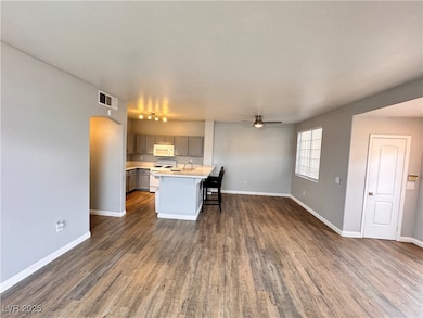 Kitchen featuring visible vents, gray cabinetry, c
