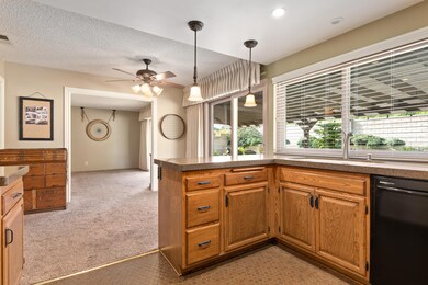 Kitchen with view of breakfast area