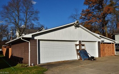 A man's dream with this 3 car detached garage and 
