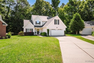 View of front of home featuring a garage and a fro