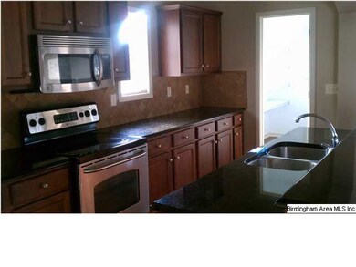 View of Kitchen area with abundant cabinet space.