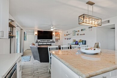 Kitchen featuring a ceiling fan, visible vents, wo