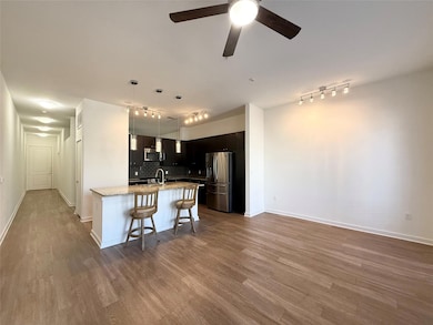 Kitchen featuring a breakfast bar area, backsplas