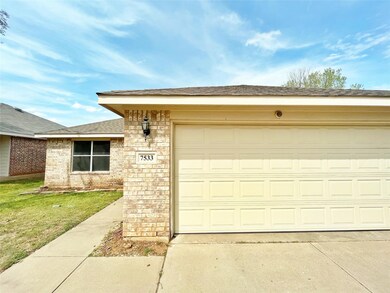 Garage with concrete driveway