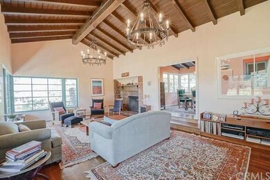 View of the living room fireplace, and the doorway