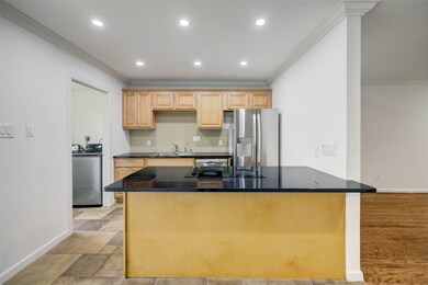 A sizeable breakfast bar opens out to the dining r