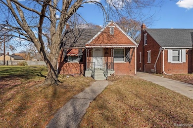 Bungalow with brick siding, a chimney, and a shingled roof