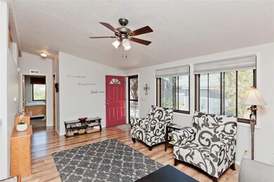 Room is flooded with natural light through the lar