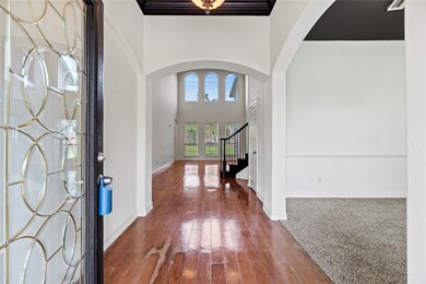 Inviting front entry boasts a gorgeous leaded glas