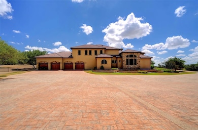 Mediterranean / spanish house featuring curved dr