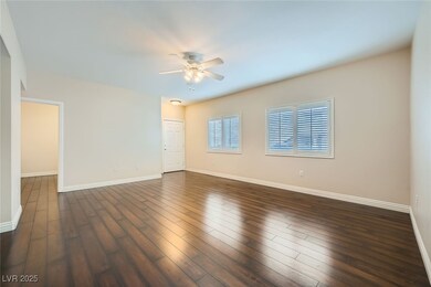Spare room with dark wood-type flooring, a ceiling