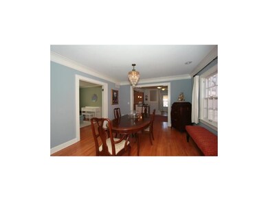 The formal dining room leads to the kitchen for ea